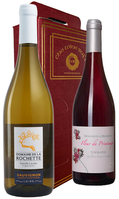 Two Loire Valley wine bottles, one white and one red, with a box labeled 'The Wine Buff' in the background.