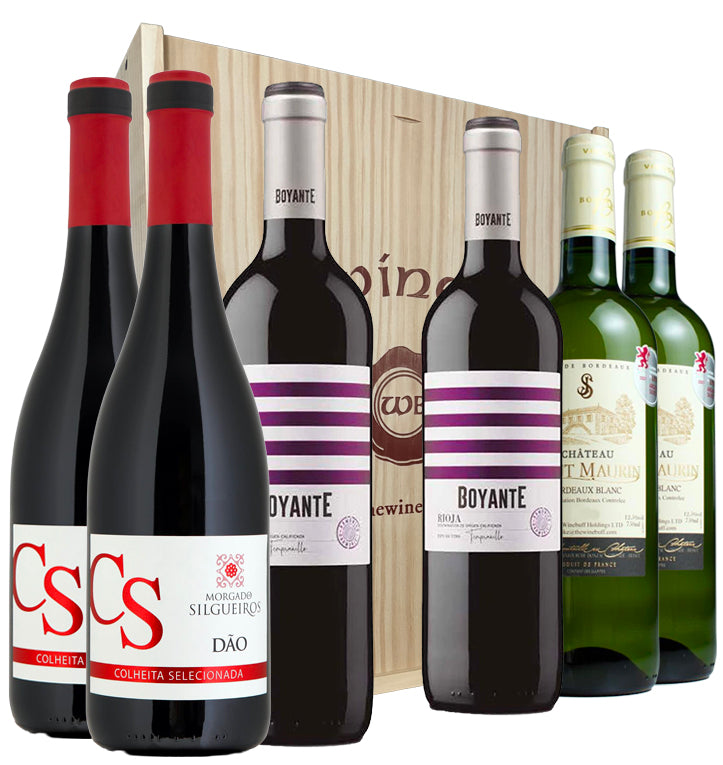 Collection of wine bottles with visible labels in front of a wooden wine gift box.