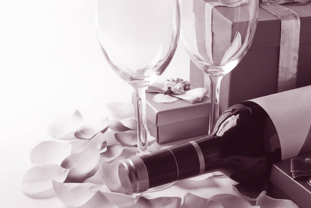 Wine gift bottle, glasses, and gift boxes on a white background